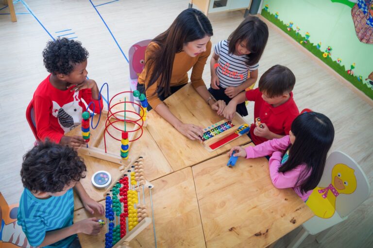 Young children at Starfish Early Learning Centre playing and interacting together, building social skills through group activities and teamwork