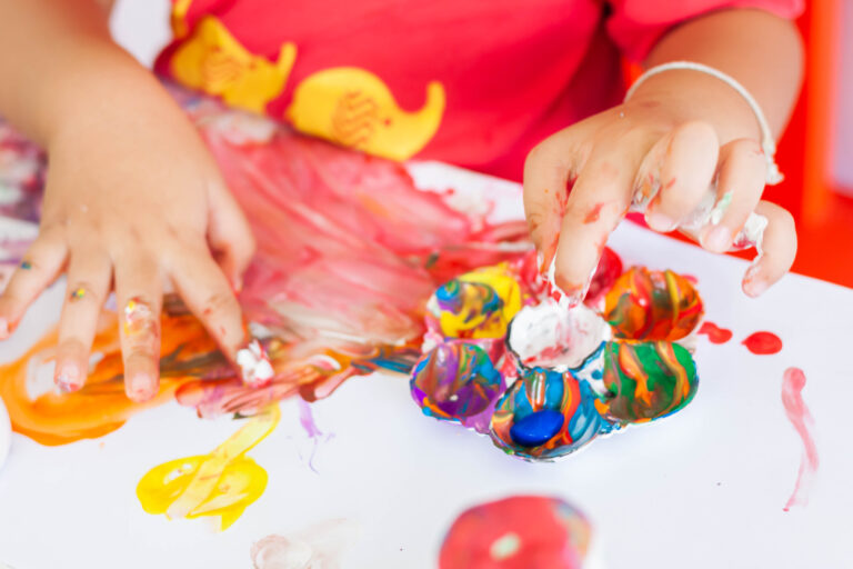Children engaging in weekend activities at Starfish ELC — painting, outdoor play, sensory exploration, and storytelling with family and friends.